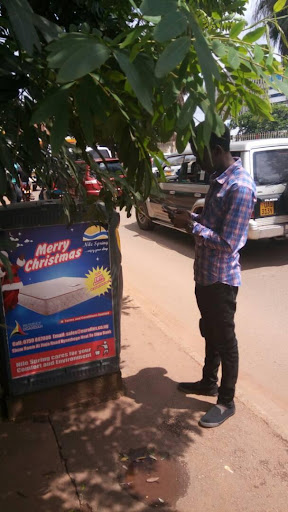 Hillary Musundi mapping rubbish bins in Kampala